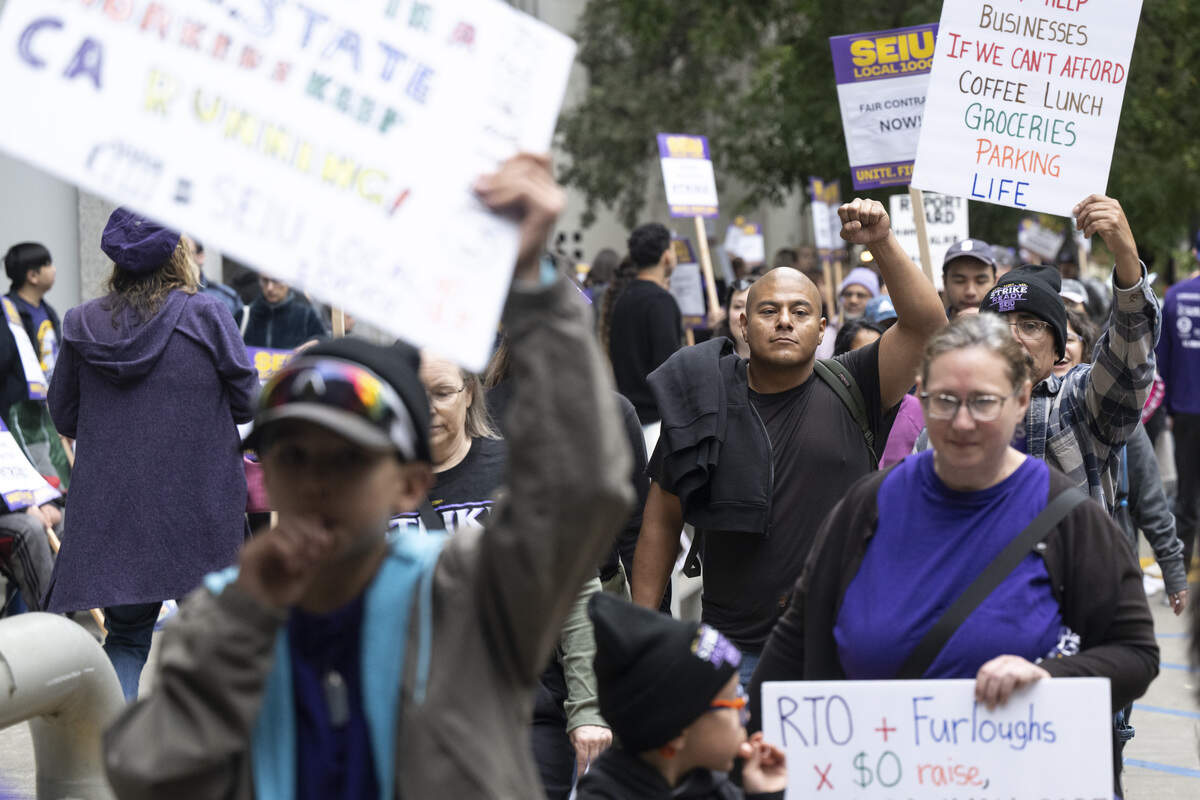 SEIU 1000 members strike outside the California Department of Education Headquarters in Sacramento on Wednesday, Oct. 21, 2026.